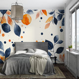 Modern bedroom featuring navy and orange botanical wallpaper behind bed