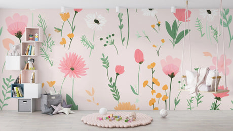 Floral wall mural with pastel poppies and daisies in a bright, modern nursery setting with white furniture