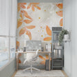 Peach and gold leaf wallpaper in bright modern living room showing scale and elegance of floral pattern