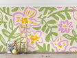 Pink and green Floral Mural Wallpaper creating a bright, airy atmosphere in a modern living room setting