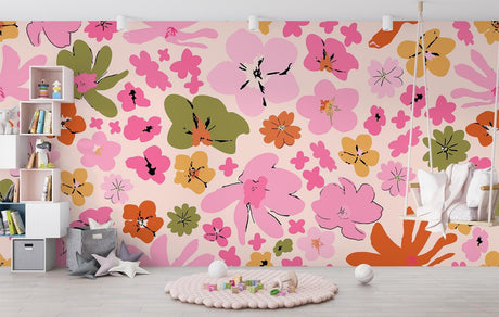 Pink and orange floral wallpaper mural in a bright modern living room, creating a cheerful accent wall