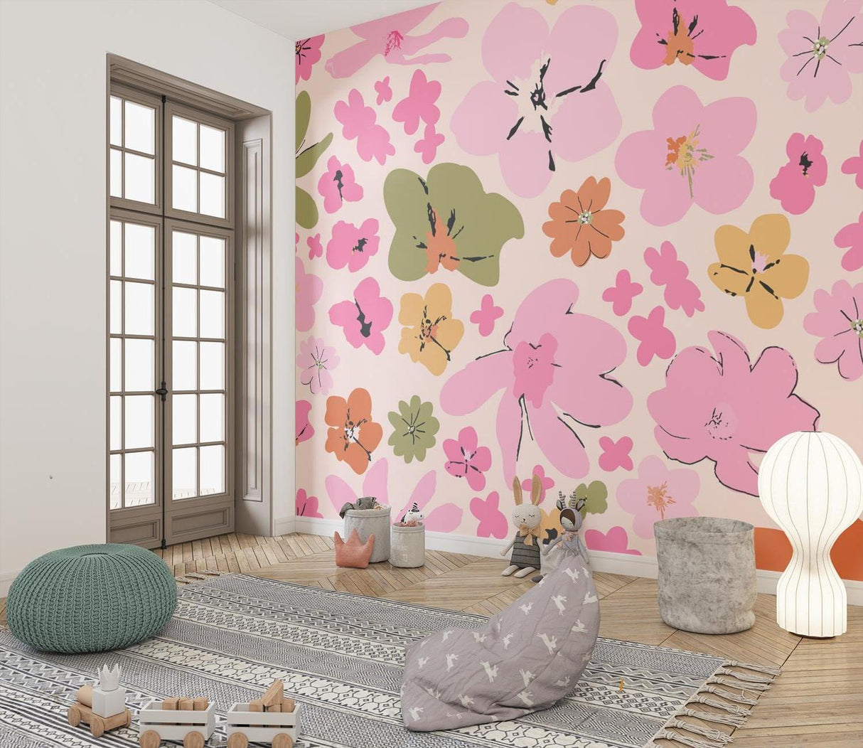 Abstract floral mural wallpaper with pink blooms styled in a cozy bedroom setting