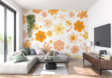 Retro orange and yellow floral wallpaper brightening up a home office space