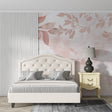 Rose gold leaf wallpaper creating a warm glow in a modern living room with grey furniture