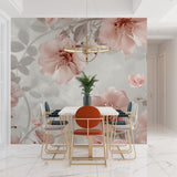 Pink and grey floral mural creating depth in a cozy reading nook
