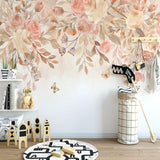 Floral wall mural with soft pink roses and butterflies adding charm to a nursery space