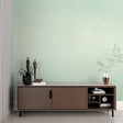 Mint green floral wallpaper in a bright modern living room setting with natural light