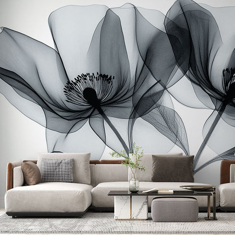 Black and white floral wallpaper creating an elegant atmosphere in a modern living room with natural light