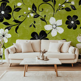 Green floral mural installation in modern hallway with minimal furniture
