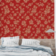 Red and beige floral wallpaper in a bright living room setting with modern furniture