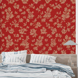 Red and beige floral wallpaper in a bright living room setting with modern furniture