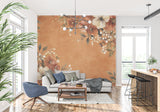 Botanical wallpaper creating cozy reading nook with terracotta and cream flowers
