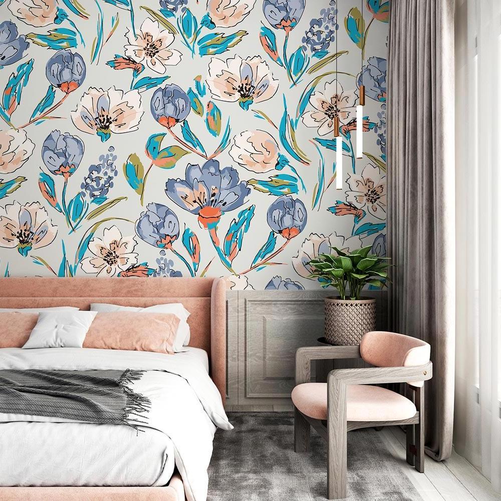 Soft watercolor blooms wallpaper adding charm to a home office space with natural lighting