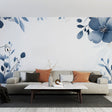 Blue watercolor floral wallpaper creating a peaceful atmosphere in a bright modern bedroom with natural light