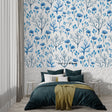 Blue floral wallpaper creating a peaceful atmosphere in a modern living room with natural light