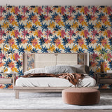 Navy and coral watercolor floral wallpaper brightening a modern living room with natural light and minimal furniture