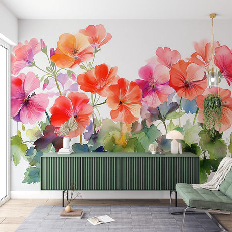Watercolor floral wallpaper with coral geraniums creating a fresh spring feel in a bright modern living room