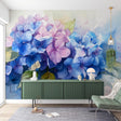Hydrangea floral wallpaper in bright modern living room, showing blue and pink watercolor blooms creating a fresh garden feel