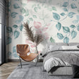 Watercolor floral wallpaper in modern living room showing pink and blue leaves creating a fresh, airy atmosphere