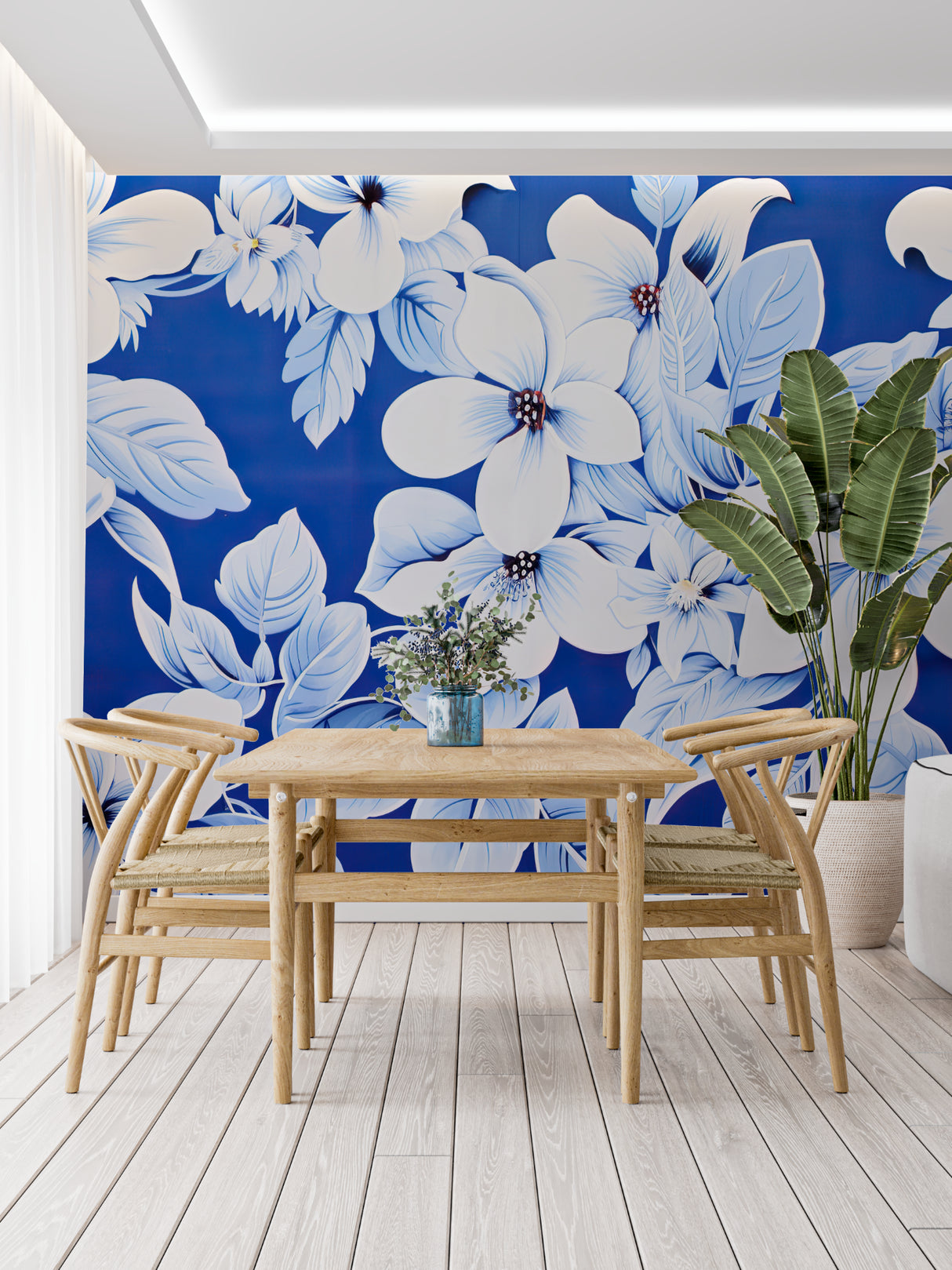 Blue and white floral wall mural brightening a cozy bedroom with natural light