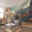 Pterodactyl wallpaper bringing prehistoric adventure to a modern kids bedroom with blue and rust tones