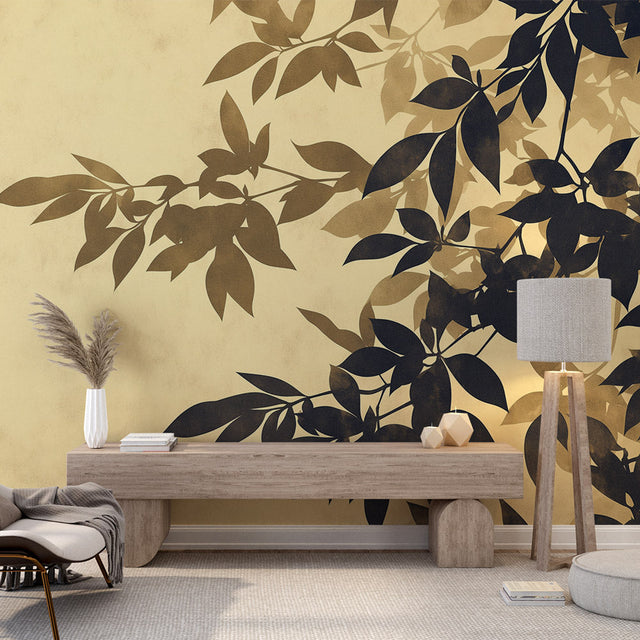 Black and gold botanical wallpaper creating drama in a modern living room with tall windows