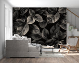 Botanical black wallpaper with silver leaves making a dining room feel cozy