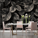 Dark leaf mural with silver details in a stylish bedroom