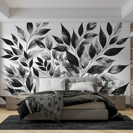Black and white botanical wallpaper creating depth in a minimal Scandinavian living room with natural light