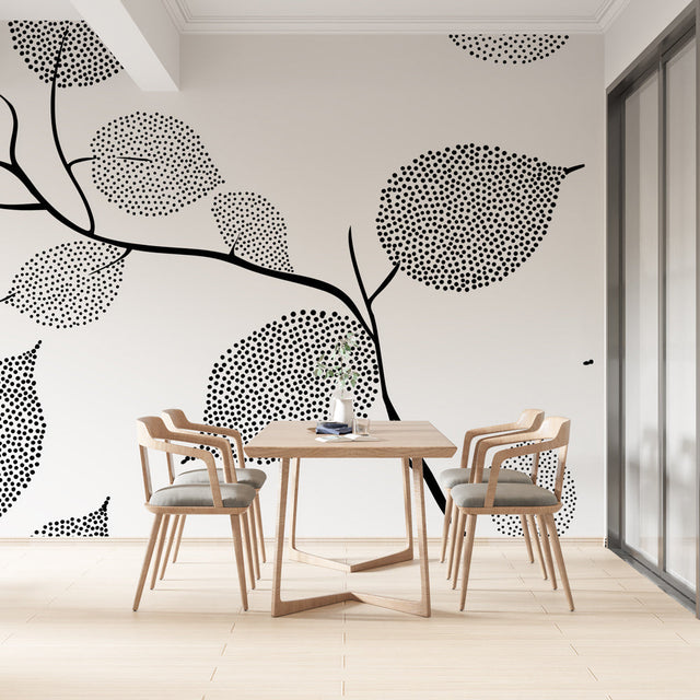Black and white dotted leaf wallpaper in a bright modern home office, showing how the pattern creates depth and interest