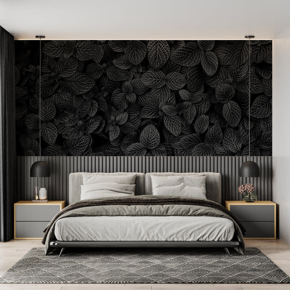 Black and white leaf wallpaper in modern living room creating dramatic focal point