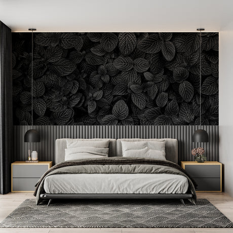Black and white leaf wallpaper in modern living room creating dramatic focal point