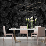 Botanical wall mural in dining room with monochrome leaf design