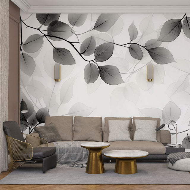 Black and white botanical wallpaper with translucent leaves creating a dramatic statement wall in a modern living room