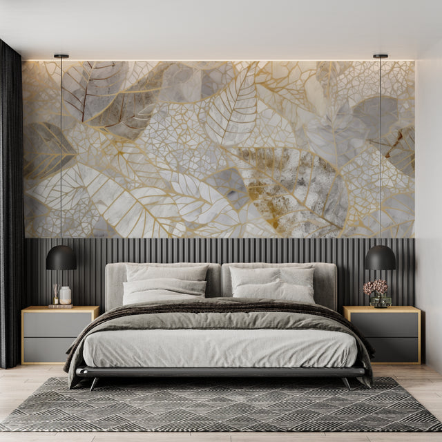 Gold and grey leaf wallpaper in modern living room with natural light highlighting metallic details