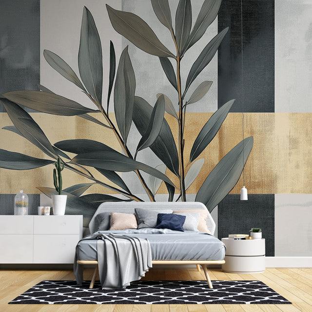 Botanical gold leaf wallpaper in modern living room, creating an elegant accent wall with soft grey and metallic details