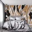 Modern black leaf wallpaper in a bright living room with minimalist furniture