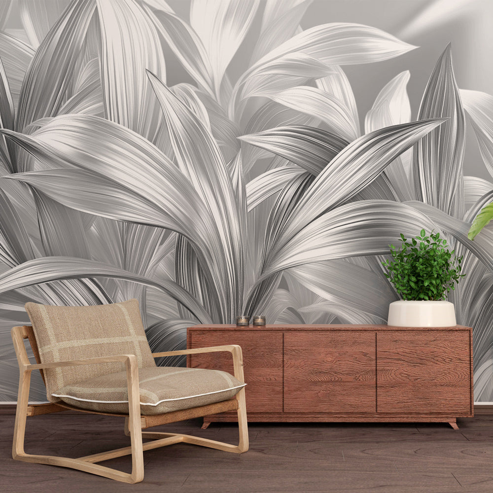 Silver leaf wallpaper mural in modern dining room with dramatic lighting showcasing metallic botanical design