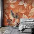 Terracotta leaf wallpaper in a bright living room creating a warm, welcoming atmosphere