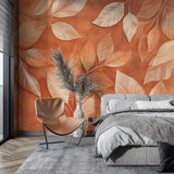 Terracotta leaf wallpaper in a bright living room creating a warm, welcoming atmosphere
