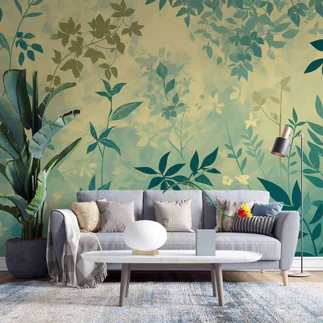 Tropical leaf wallpaper creating a peaceful atmosphere in a modern living room with sage and gold accents