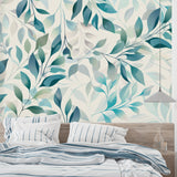 Turquoise and sage botanical wallpaper in modern living room with grey sofa and natural light