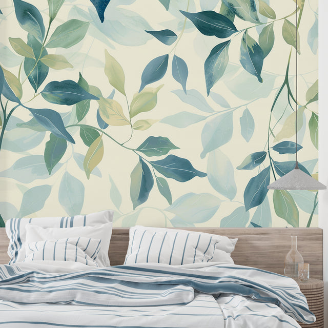 Botanical wallpaper with blue and green watercolor leaves creating a serene atmosphere in a modern living room