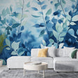 Blue watercolor foliage wallpaper creating a serene atmosphere in a modern bedroom with natural light