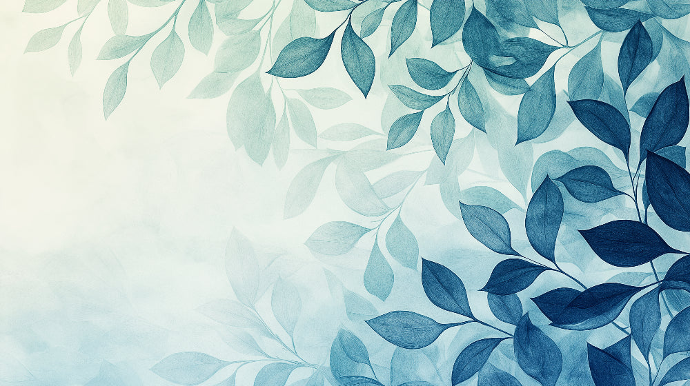 Blue watercolor leaf wallpaper creating a fresh look in a modern living room with white furniture and natural light