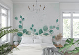 Botanical wallpaper creating a fresh look in a minimalist dining room setting