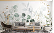 Botanical wallpaper with gold-traced eucalyptus leaves creating a calm atmosphere in a modern living room