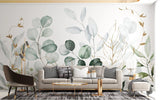 Botanical wallpaper with gold-traced eucalyptus leaves creating a calm atmosphere in a modern living room