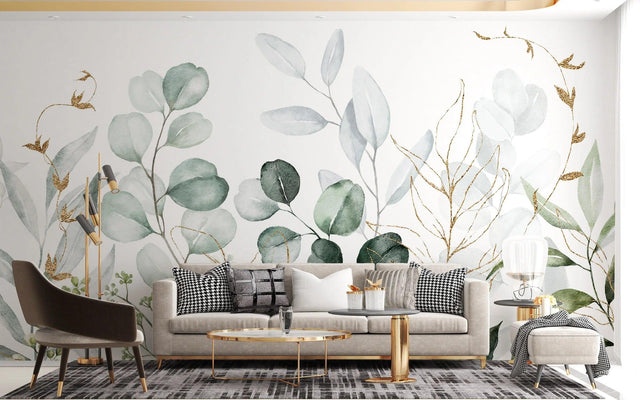 Botanical wallpaper with gold-traced eucalyptus leaves creating a calm atmosphere in a modern living room