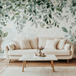 Botanical leaf wallpaper mural in modern living room creating a fresh, natural atmosphere